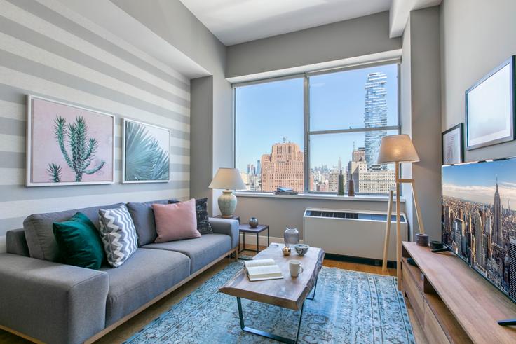 Elegantly designed living room with modern furnishings in an apartment at 50 Murray Street in Tribeca, New York