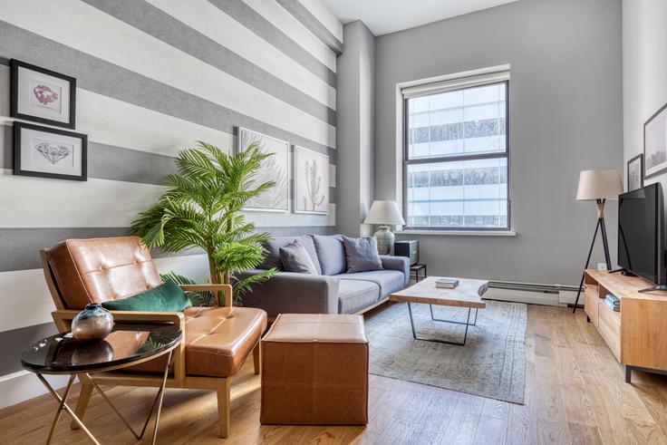 Elegantly designed living room with modern furnishings in an apartment at 53 Park Place in Tribeca, New York