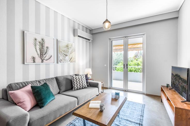 Chic living room with minimalist design from a furnished apartment in Glyfada, Athens