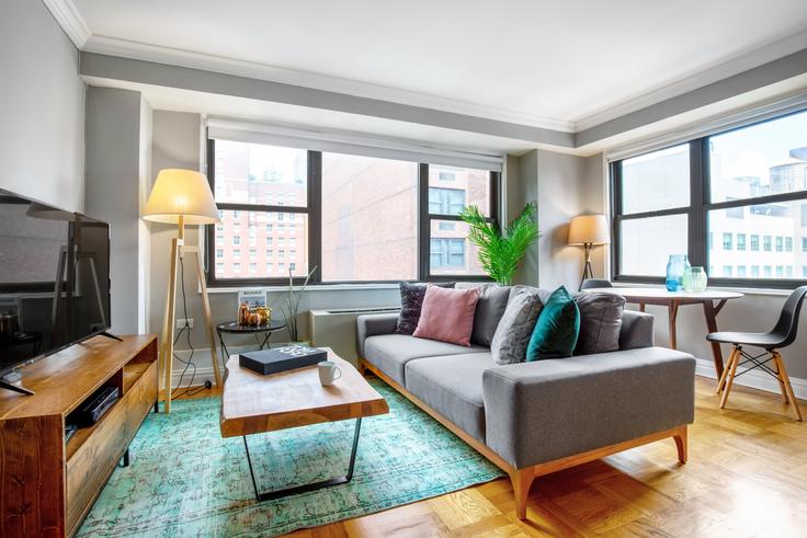 Elegantly designed living room with modern furnishings in an apartment at Stonehenge 33 in Kips Bay, New York