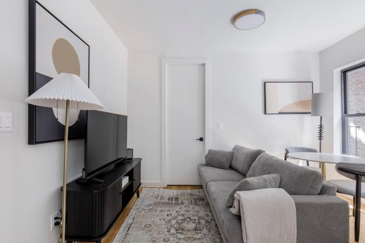 Elegantly designed living room with modern furnishings in an apartment at The Melissa in Manhattan, New York