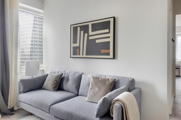 Salle de séjour élégante avec mobilier moderne dans un appartement à Cassa à Manhattan, New York Salle de séjour élégante avec mobilier moderne dans un appartement à Cassa à Manhattan, New York