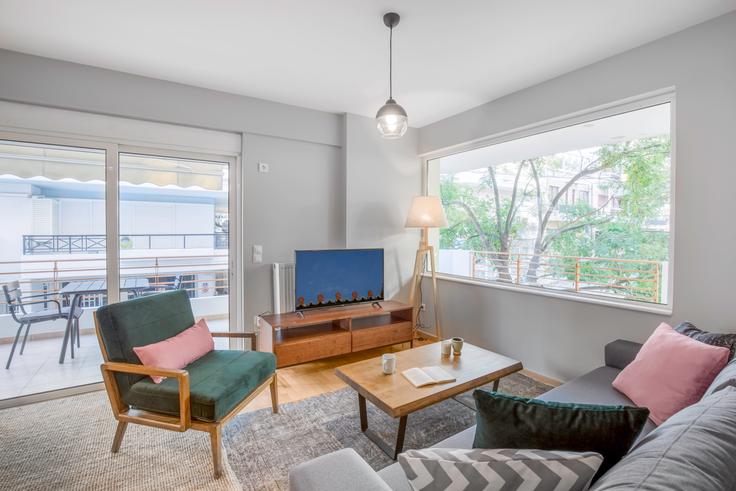 Elegantly designed living room with modern furnishings in an apartment at b1025bb0-b07e-418f-9ae5-0417747a9fcd in Koukaki, Athens