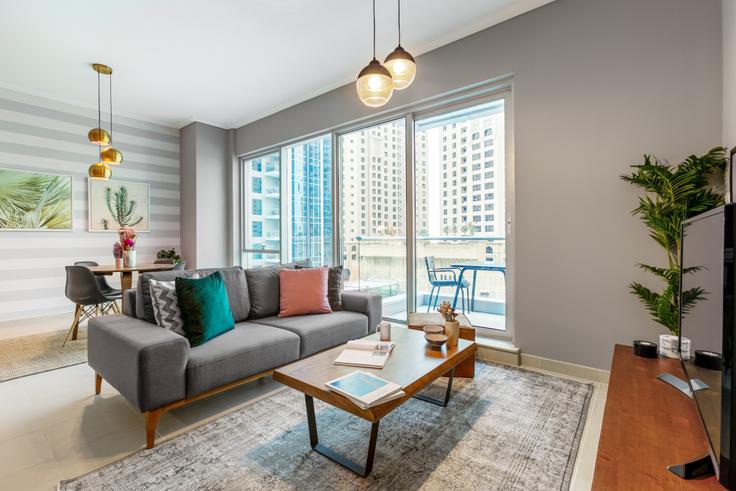 Elegantly designed living room with modern furnishings in an apartment at Marina Promenade Paloma in Dubai Marina, Dubai