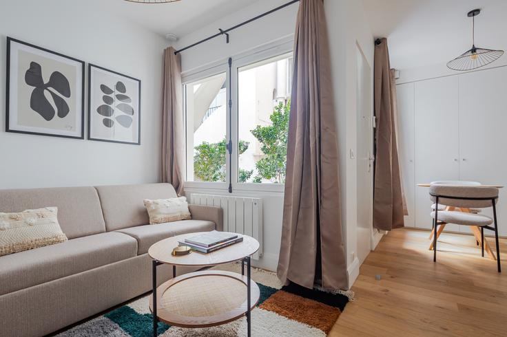 Elegantly designed living room with modern furnishings in an apartment at Paul Valéry 16 in 16th arrondissement, Paris