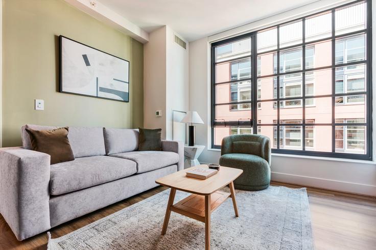 Elegantly designed living room with modern furnishings in an apartment at Incanto in Washington, Washington Elegantly designed living room with modern furnishings in an apartment at Incanto in Washington, Washington