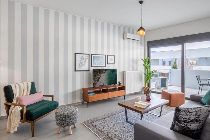 Chic living room with minimalist design from a furnished apartment in Marousi, Athens