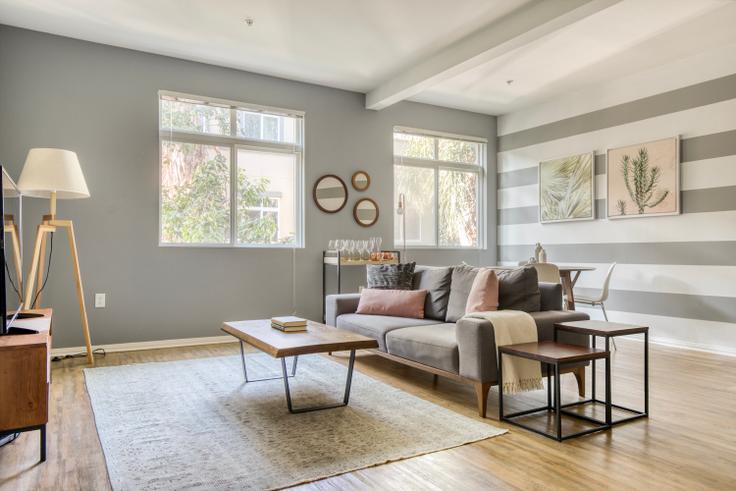 Elegantly designed living room with modern furnishings in an apartment at Playa Del Oro in Playa del Rey, Los Angeles