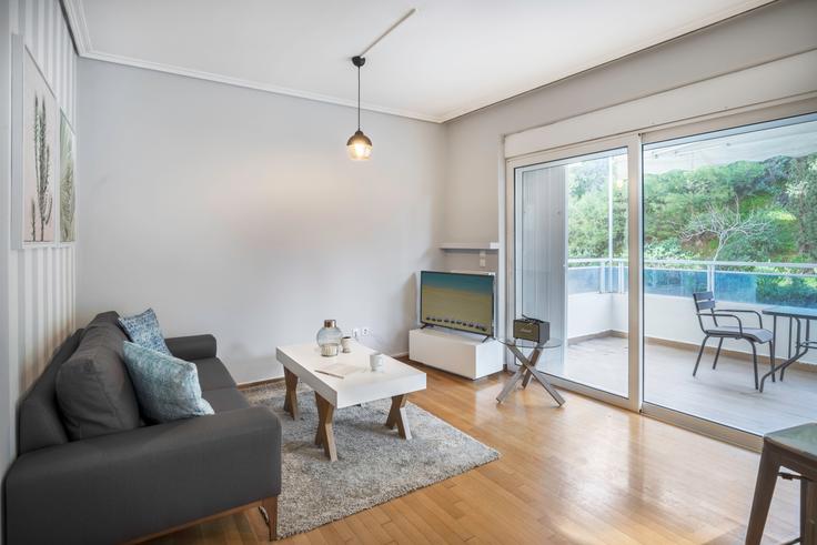 Elegantly designed living room with modern furnishings in an apartment at 9d30d801-338d-483d-aa1f-0ebb74a15c67 in Kolonaki, Athens