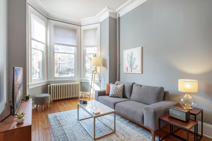 Elegantly designed living room with modern furnishings in an apartment at 1503 Vermont in Logan Circle, Washington D.C.