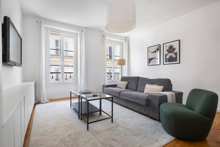 Salle de séjour élégante avec mobilier moderne dans un appartement à Lekain 4 à 16th arrondissement, Paris