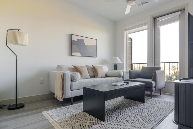 Elegantly designed living room with modern furnishings in an apartment at Del Via in Austin, Austin Elegantly designed living room with modern furnishings in an apartment at Del Via in Austin, Austin