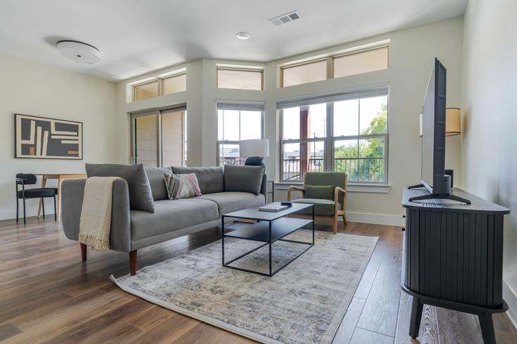 Elegantly designed living room with modern furnishings in an apartment at The Kelsey in Austin, Austin Elegantly designed living room with modern furnishings in an apartment at The Kelsey in Austin, Austin