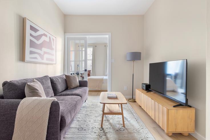 Elegantly designed living room with modern furnishings in an apartment at 77 Barrow in Manhattan, New York