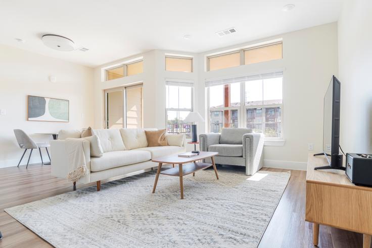 Elegantly designed living room with modern furnishings in an apartment at The Kelsey in Austin, Austin Elegantly designed living room with modern furnishings in an apartment at The Kelsey in Austin, Austin