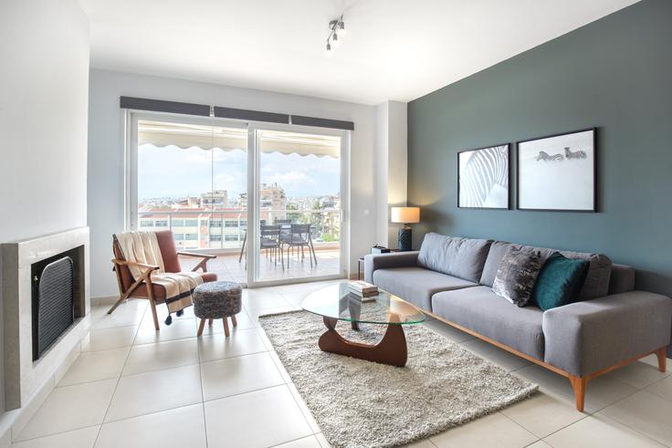 Elegantly designed living room with modern furnishings in an apartment at 2c6b925e-6739-4a5b-bdf8-4f6b1b157e1e in Elliniko, Athens