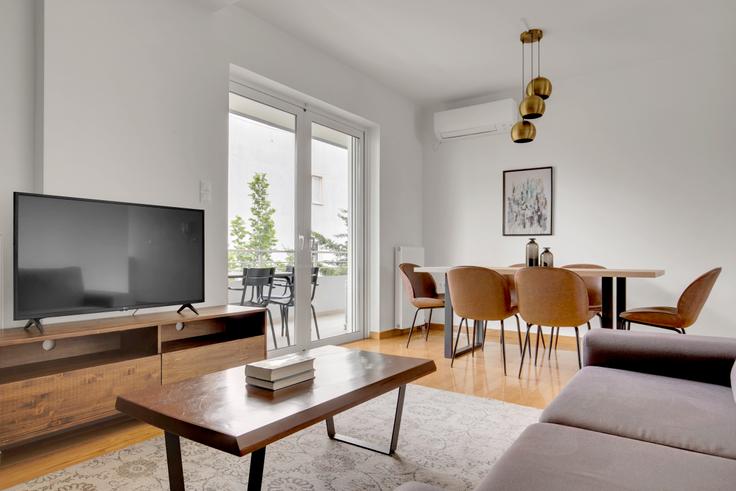 Chic living room with minimalist design from a furnished apartment in Agia Paraskevi, Athens