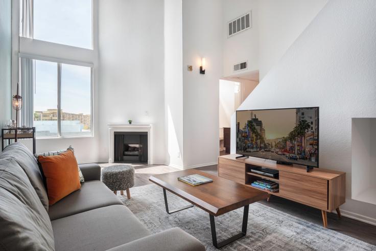 Elegantly designed living room with modern furnishings in an apartment at 630 Hauser in Mid-Wilshire, Los Angeles