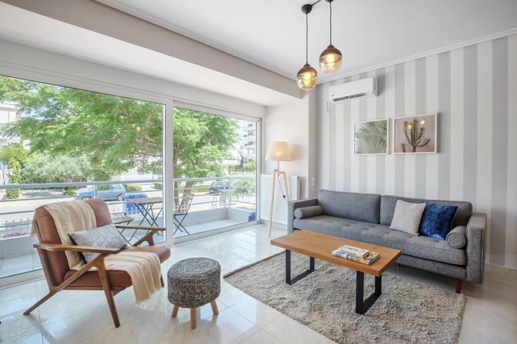 Chic living room with minimalist design from a furnished apartment in Glyfada, Athens