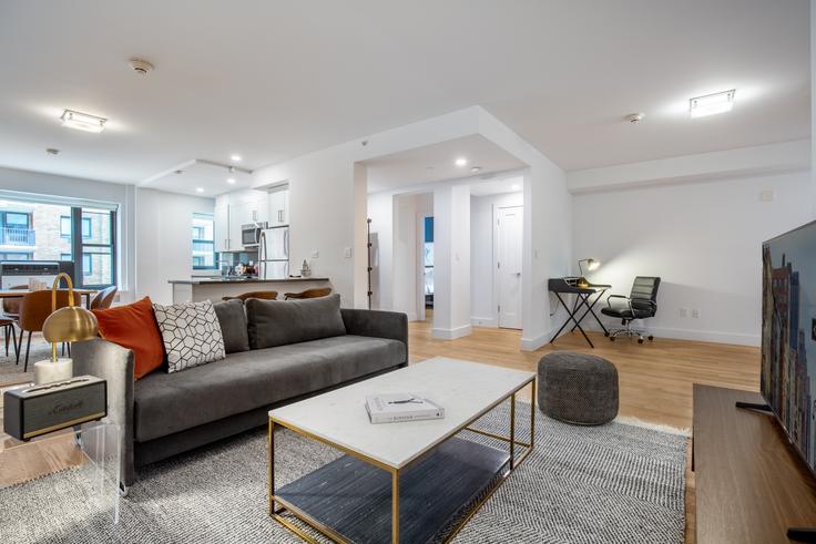 Elegantly designed living room with modern furnishings in an apartment at 10 West 65th Street in Manhattan, New York