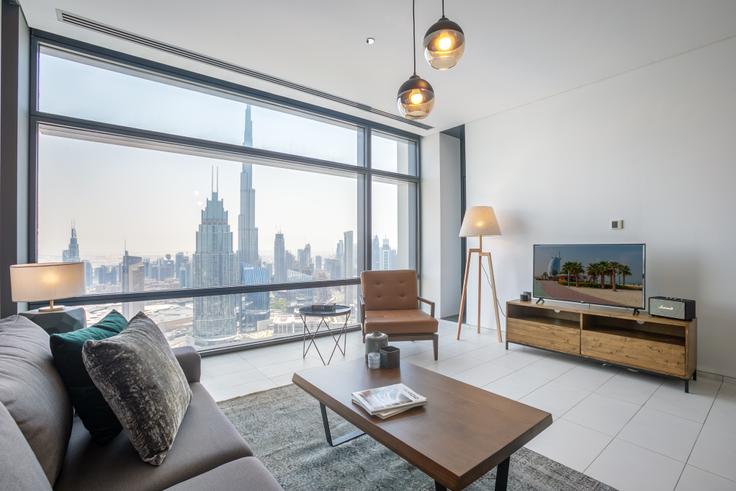 Trade Center, Dubai에 위치한 Index Tower 아파트의 세련된 인테리어가 돋보이는 거실 Trade Center, Dubai에 위치한 Index Tower 아파트의 세련된 인테리어가 돋보이는 거실