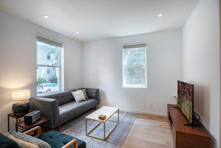 Elegantly designed living room with modern furnishings in an apartment at Avon Place in Georgetown, Washington D.C.