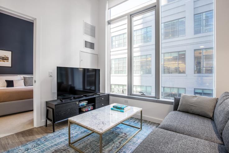 Elegantly designed living room with modern furnishings in an apartment at Spera in Rincon Hill, San Francisco Bay Area