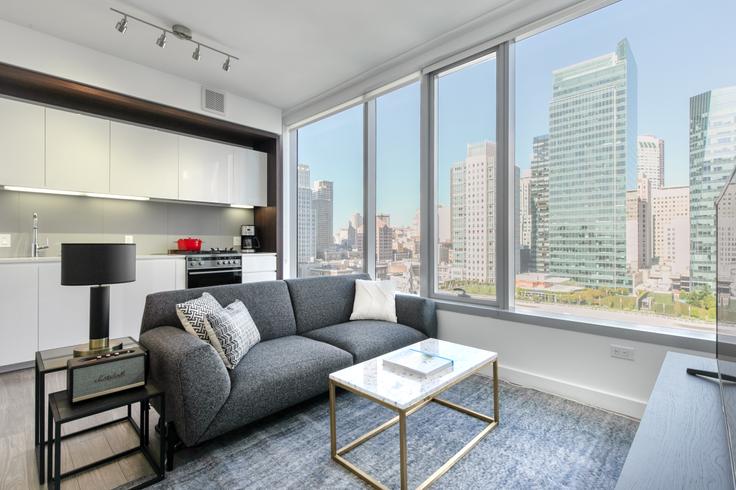 Elegantly designed living room with modern furnishings in an apartment at Spera in Rincon Hill, San Francisco Bay Area