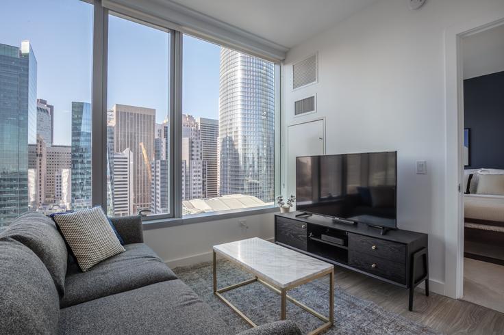 Elegantly designed living room with modern furnishings in an apartment at Spera in Rincon Hill, San Francisco Bay Area