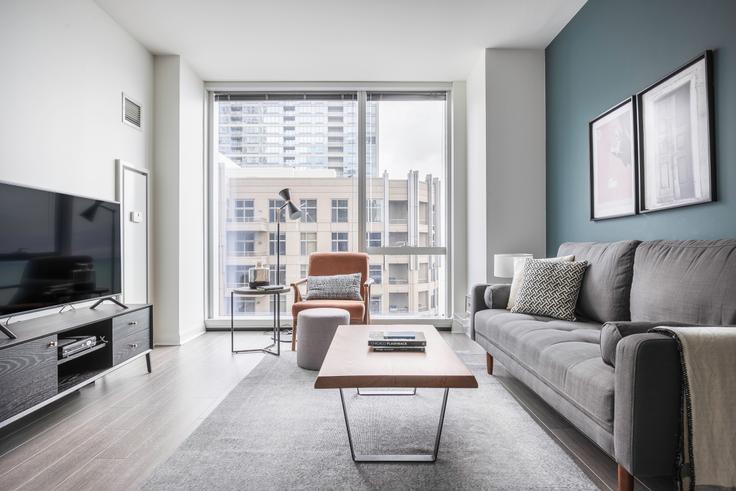 Elegantly designed living room with modern furnishings in an apartment at 500 Lake Shore in Streeterville, Chicago