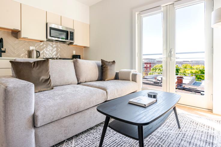 Elegantly designed living room with modern furnishings in an apartment at The Heywood in Washington, Washington Elegantly designed living room with modern furnishings in an apartment at The Heywood in Washington, Washington
