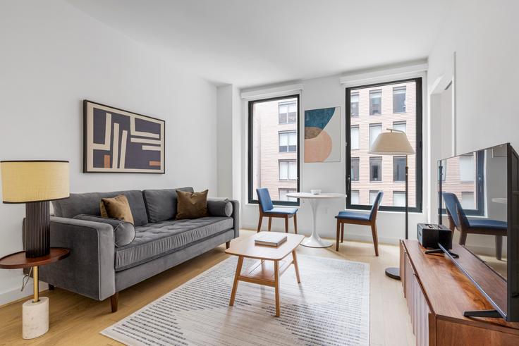 Elegantly designed living room with modern furnishings in an apartment at Ruby Chelsea in Manhattan, New York