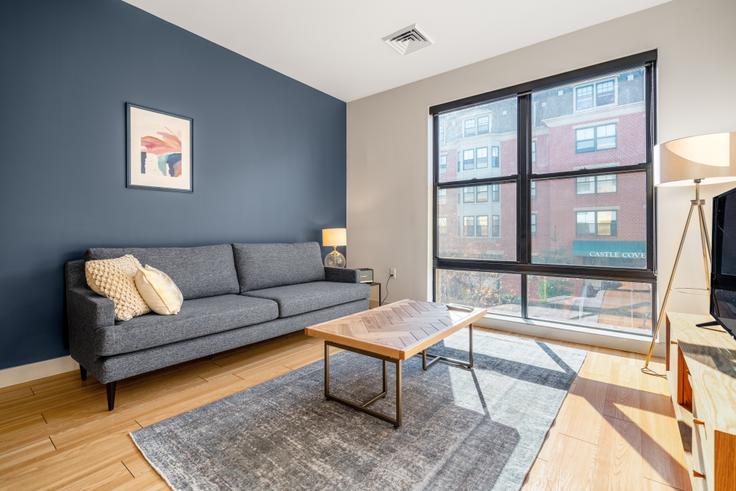 Elegantly designed living room with modern furnishings in an apartment at West Square in South Boston, Boston