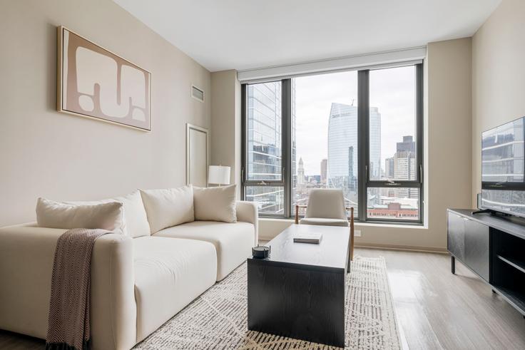 Elegant gestaltetes Wohnzimmer mit moderner Einrichtung in einer Wohnung im Avalon north station in Boston, Boston Elegant gestaltetes Wohnzimmer mit moderner Einrichtung in einer Wohnung im Avalon north station in Boston, Boston