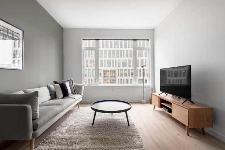 Elegantly designed living room with modern furnishings in an apartment at Marlowe in South Lake Union, Seattle