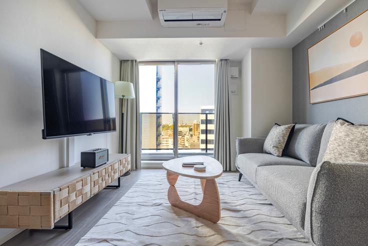 Elegantly designed living room with modern furnishings in an apartment at The Parkhabio Shibuya Cross in Meguro City, Tokyo