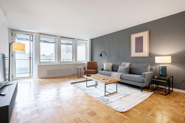 Elegantly designed living room with modern furnishings in an apartment at Avalon Prudential - 770 in Back Bay, Boston