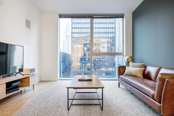 Chicago, Chicago에 위치한 Mila 아파트의 세련된 인테리어가 돋보이는 거실 Chicago, Chicago에 위치한 Mila 아파트의 세련된 인테리어가 돋보이는 거실
