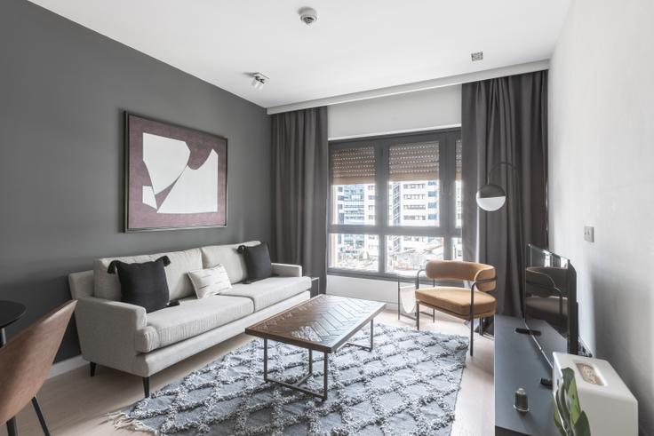 Elegantly designed living room with modern furnishings in an apartment at Soyak Soho in Esentepe, Istanbul