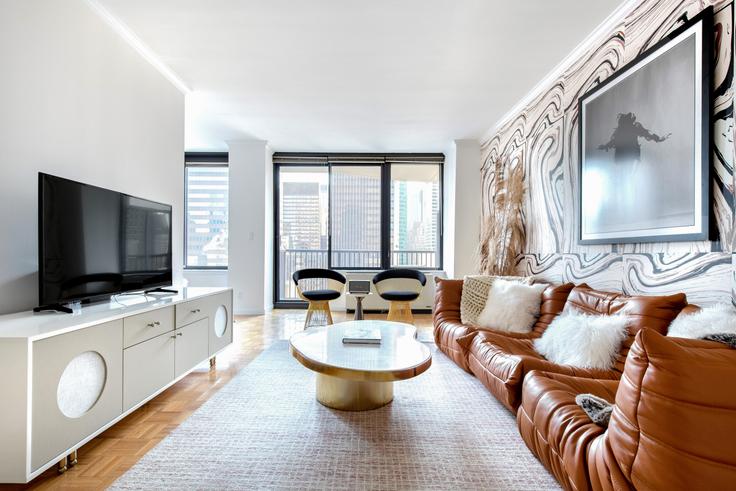 Elegantly designed living room with modern furnishings in an apartment at 150 East 57th Street in Midtown East, New York