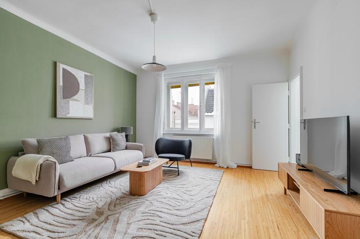 Vienna ViennaのAlser Straße 53のアパートメントにある、モダンな家具を備えたエレガントなデザインのリビングルーム Vienna ViennaのAlser Straße 53のアパートメントにある、モダンな家具を備えたエレガントなデザインのリビングルーム
