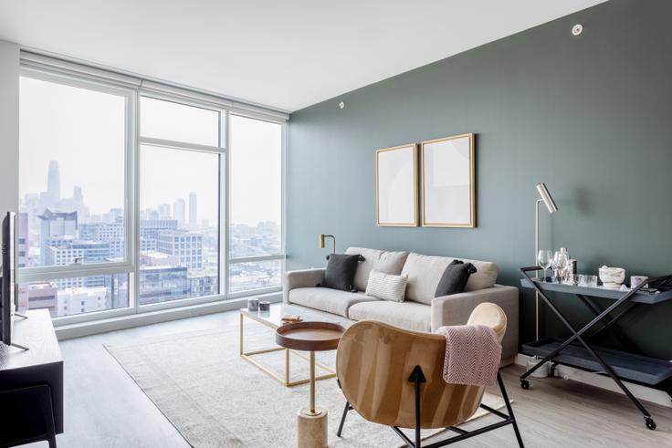 Elegantly designed living room with modern furnishings in an apartment at NEMA SF North Tower in SoMa, San Francisco Bay Area