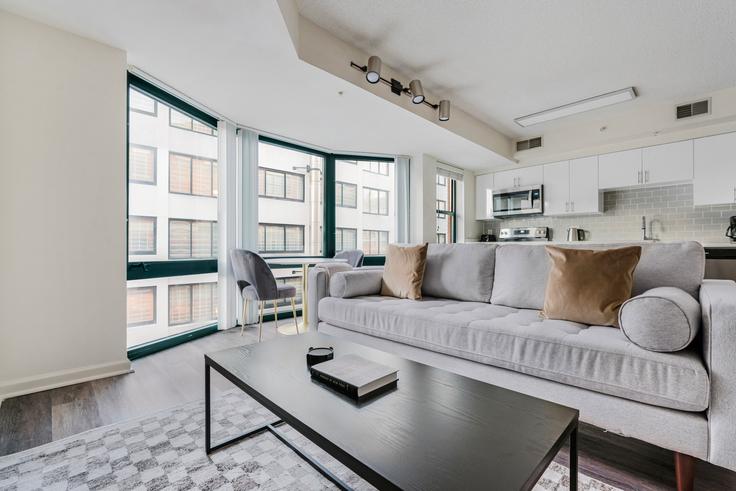 Elegantly designed living room with modern furnishings in an apartment at 1301 Thomas Circle in Washington, Washington