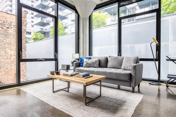 Elegantly designed living room with modern furnishings in an apartment at Ardus in River North, Chicago