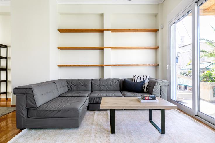 Chic living room with minimalist design from a furnished apartment in Koukaki, Athens