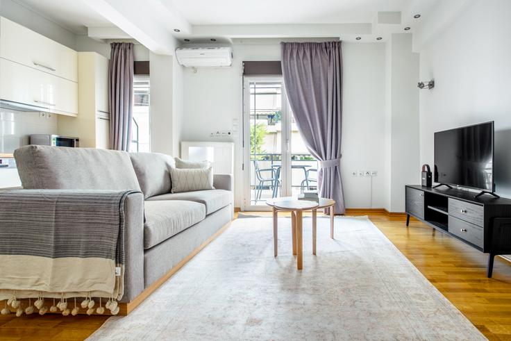 Chic living room with minimalist design from a furnished apartment in Chalandri, Athens