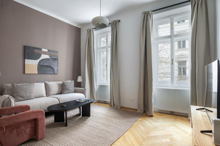 Vienna ViennaのErdberger Lände 20のアパートメントにある、モダンな家具を備えたエレガントなデザインのリビングルーム