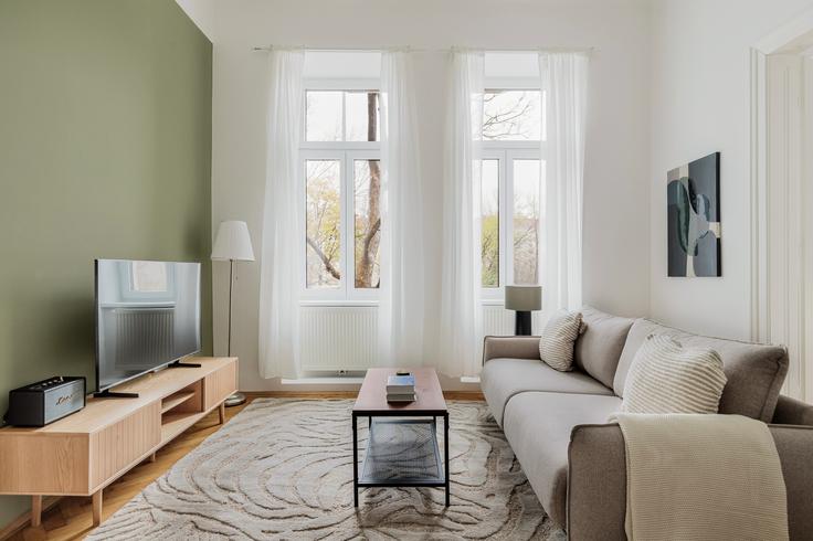 Elegant gestaltetes Wohnzimmer mit moderner Einrichtung in einer Wohnung im Erdberger Lände 22 in Vienna, Vienna Elegant gestaltetes Wohnzimmer mit moderner Einrichtung in einer Wohnung im Erdberger Lände 22 in Vienna, Vienna