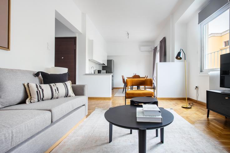 Chic living room with minimalist design from a furnished apartment in Kolonaki, Athens