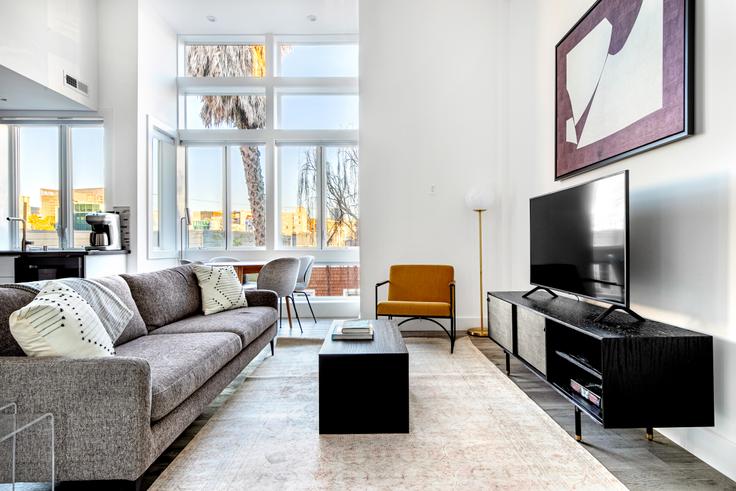 Elegantly designed living room with modern furnishings in an apartment at 272 Clara St in SoMa, San Francisco Bay Area